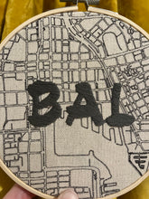 Load image into Gallery viewer, Grey - 6 inch &quot;BAL&quot; Downtown Baltimore, MD Hand-Drawn art Map of Charm City Roads &amp; Bay Hand- Embroidered Hoop
