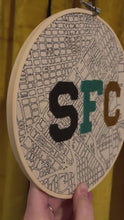 Load and play video in Gallery viewer, Grey/ Teal / Gold - 8 inch &quot;SFC&quot; Downtown San Francisco Hand-Drawn art Map of the Bay Area &amp; Hand- Embroidered Varsity Letters Hoop
