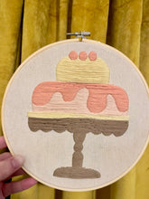 Load image into Gallery viewer, &quot;Sweet Confection&quot; 8-inch Hand-Embroidered Cake Artwork – Pastel Pink, Yellow, and Brown in Wooden Hoop
