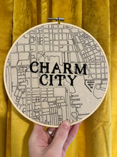 Load image into Gallery viewer, Black - 8 inch &quot;Charm City&quot; Downtown Baltimore, MD Hand-Drawn art Map of MD Roads &amp; Hand- Embroidered Hoop
