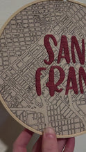 Load and play video in Gallery viewer, Dusty Rose Pink - 8 inch &quot;San Fran” Downtown San Francisco and Bay Area Hand-Drawn art Map &amp; Hand- Embroidered City name Hoop

